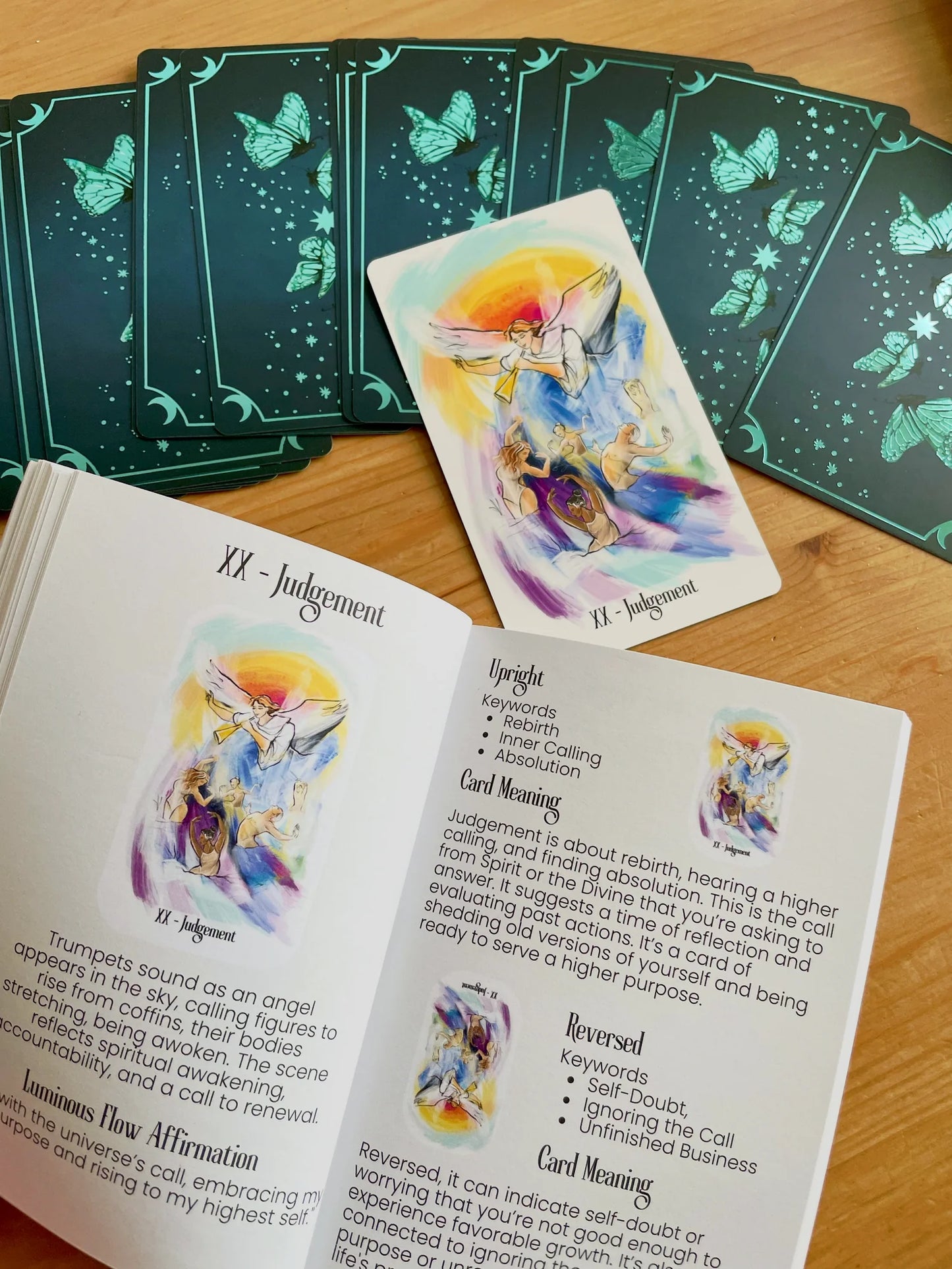 Luminous Flow Tarot first edition deck with watercolor artwork and gold detailed box.
