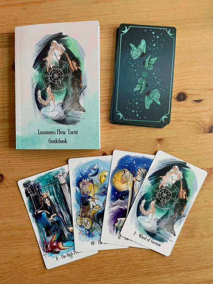 Luminous Flow Tarot first edition deck with watercolor artwork and gold detailed box.