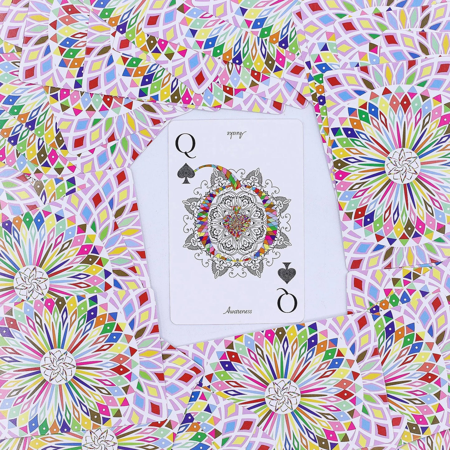 Colorful geometric pattern with a playing card featuring a mandala design.