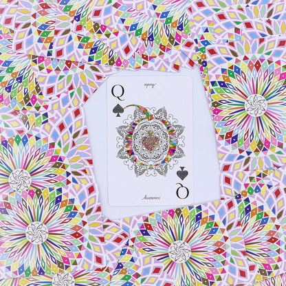 Colorful geometric pattern with a playing card featuring a mandala design.