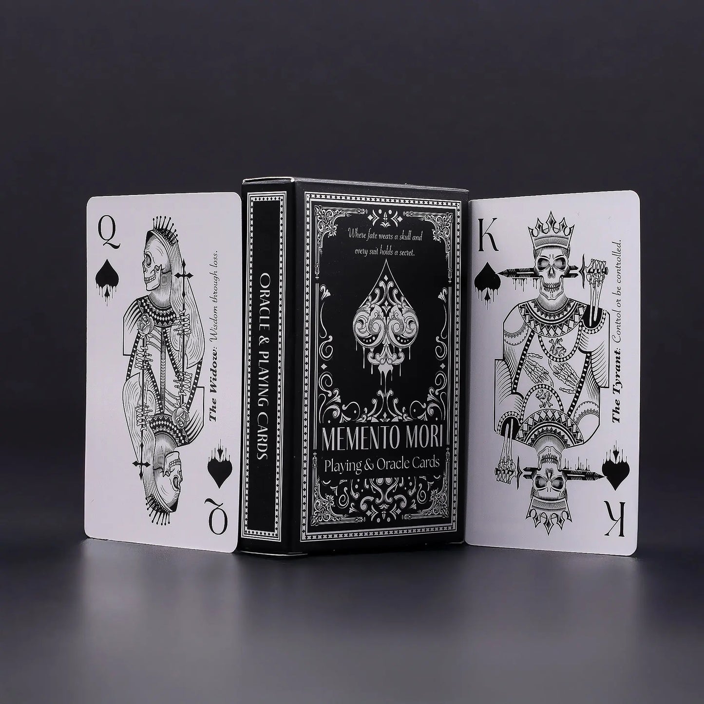 Playing cards with black and white design on a dark background, Memento Mori Skulls Oneness Emporium