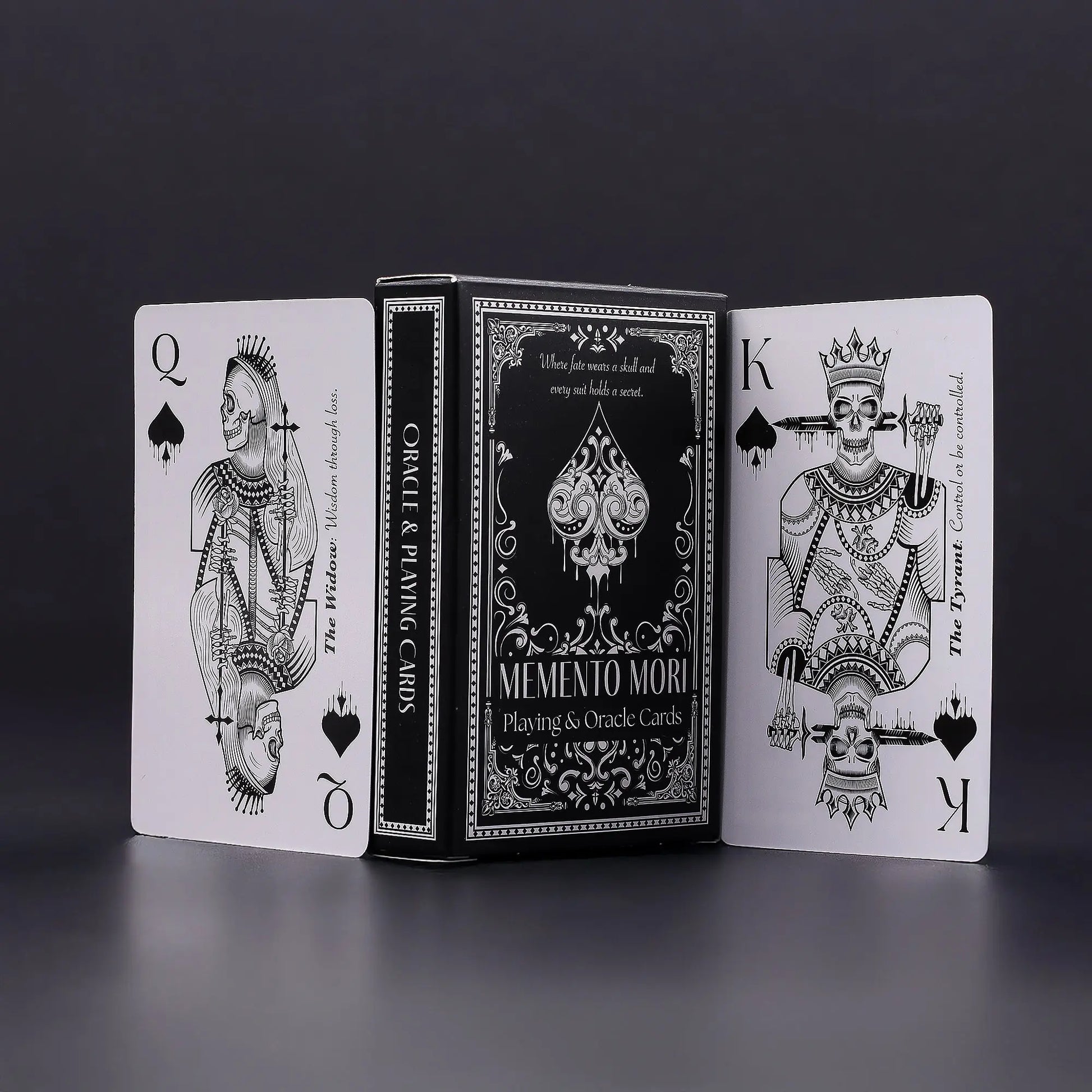 Playing cards with black and white design on a dark background, Memento Mori Skulls Oneness Emporium