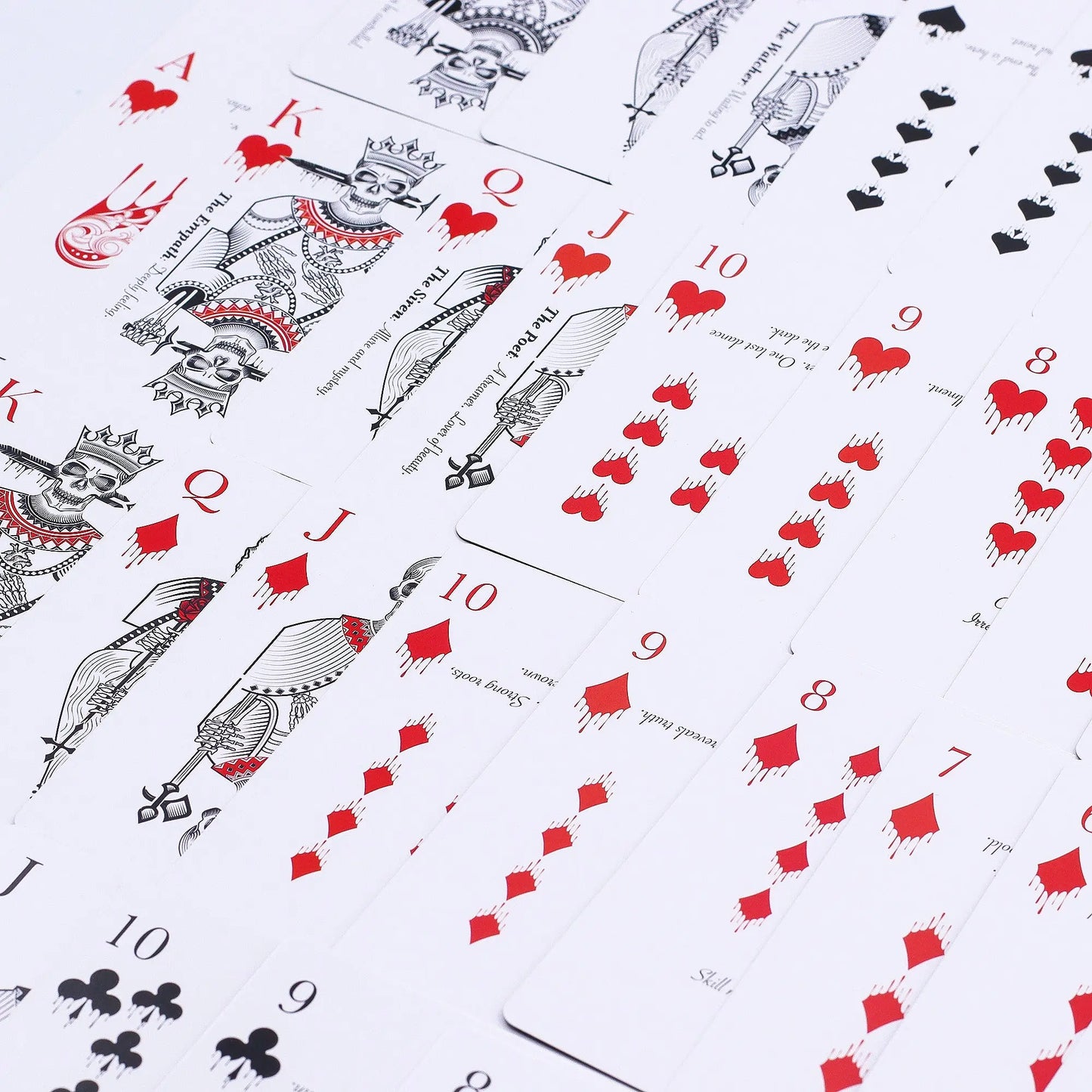Playing cards with red and black symbols on a white background