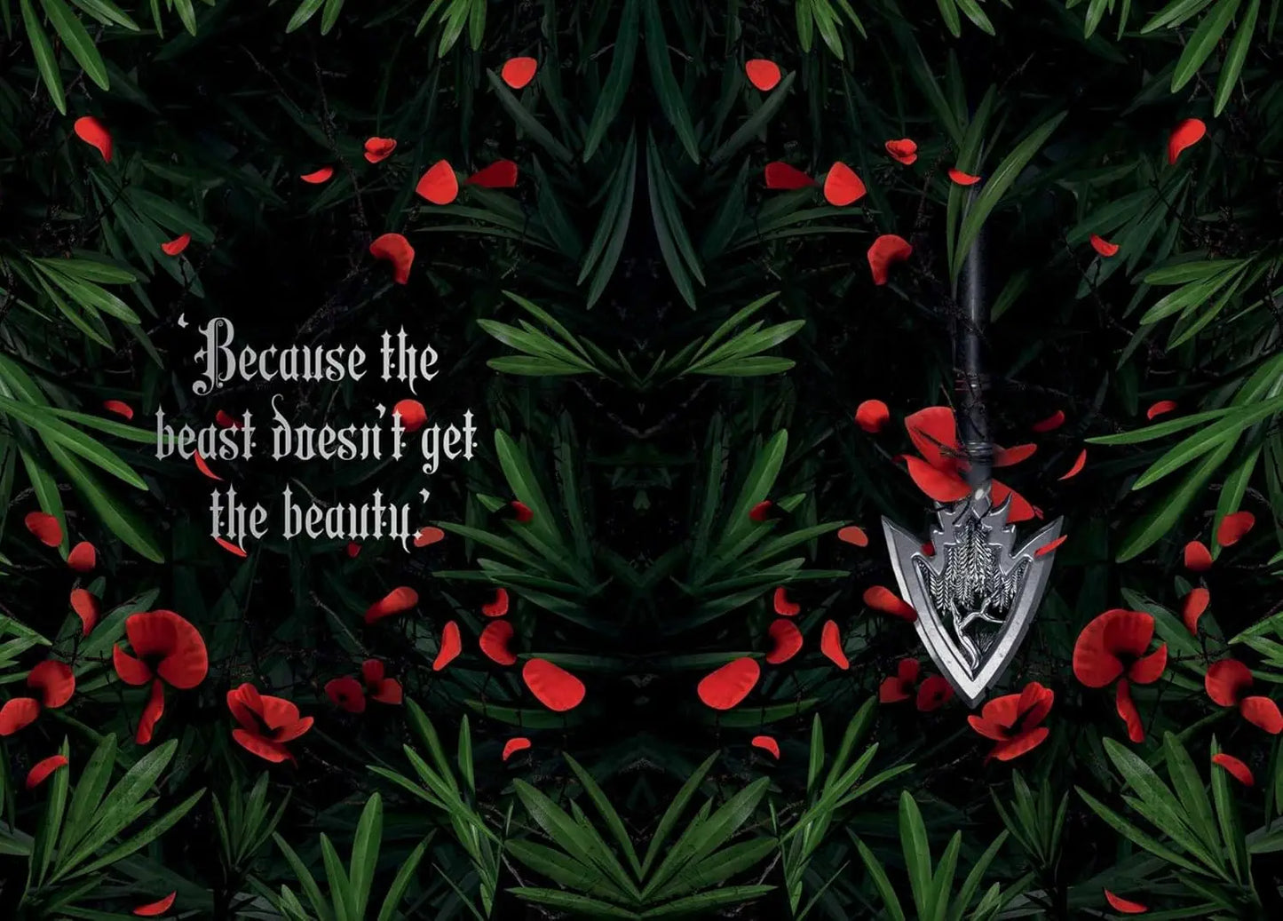 Silver arrowhead pendant on a dark background with red flowers and text.