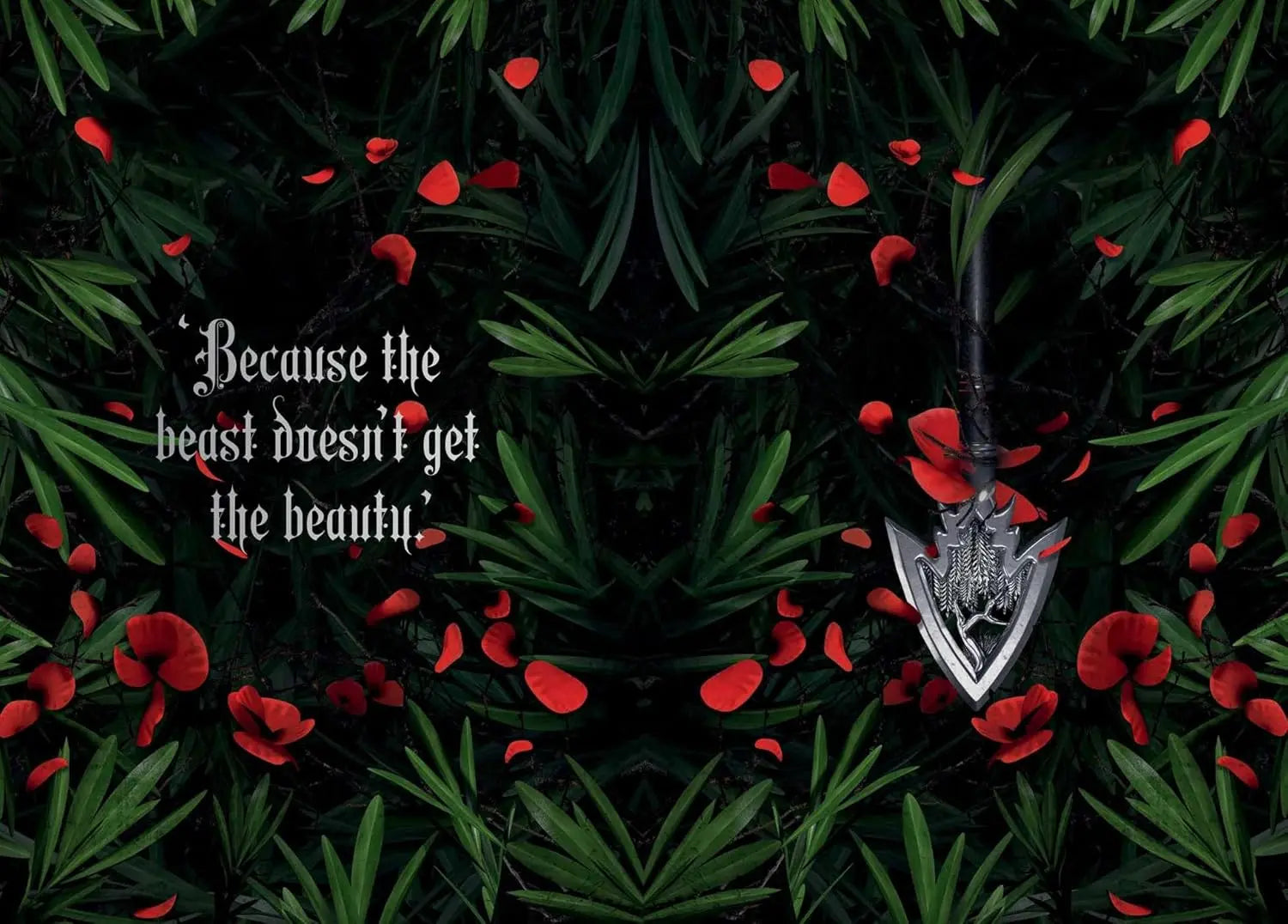 Silver arrowhead pendant on a dark background with red flowers and text.