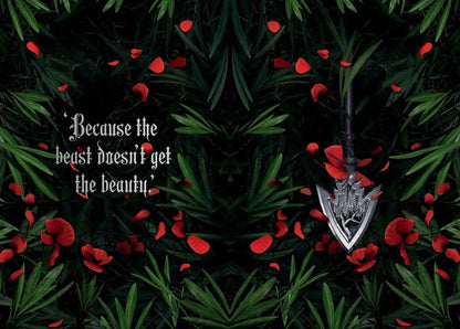 Silver arrowhead pendant on a dark background with red flowers and text.