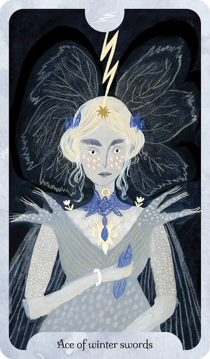 Seasons of the Witch Winter Tarot by Lorriane Anderson featuring beautiful winter-inspired artwork celebrating Yule, Imbolc, and the Wheel of the Year. Ace of swords