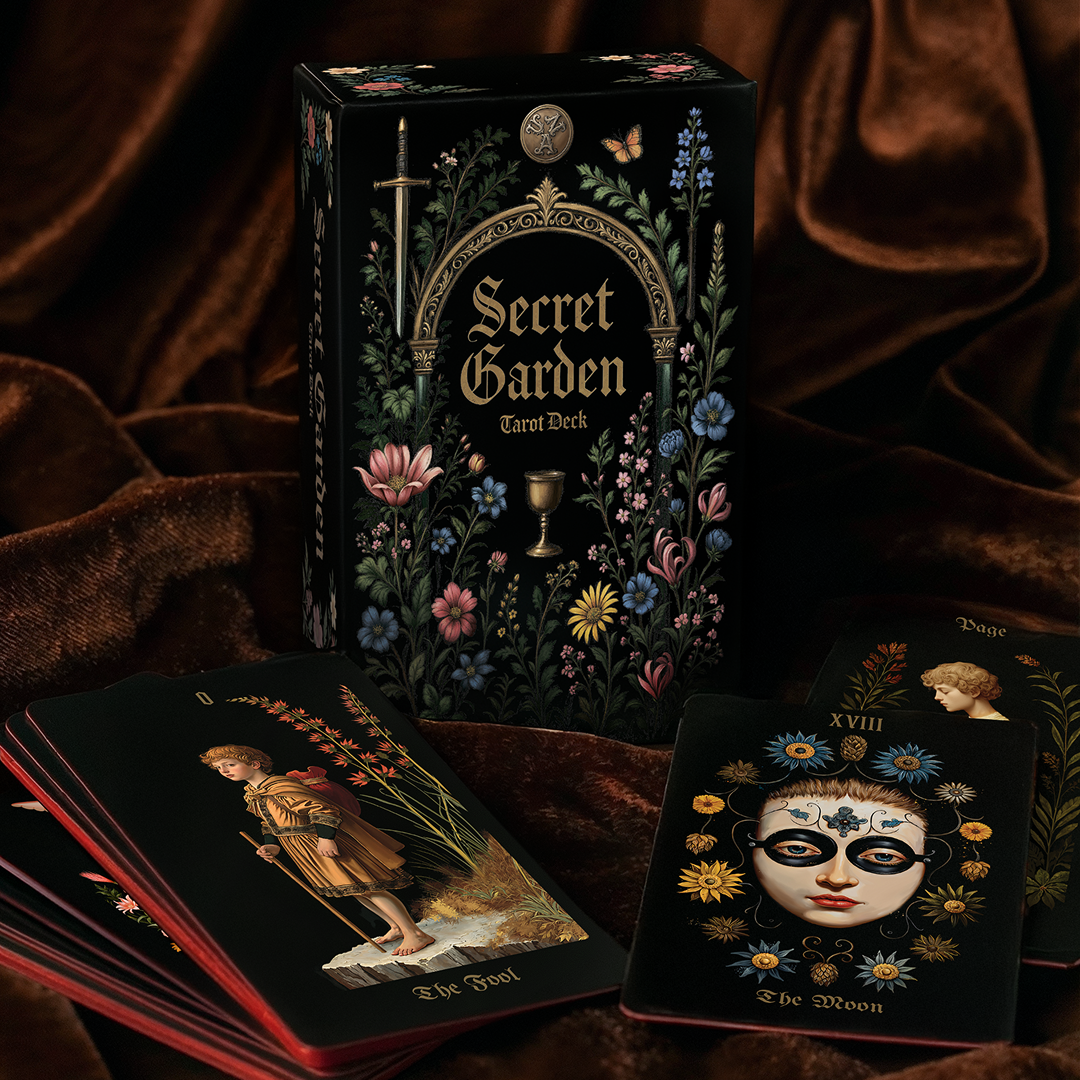 Secret Garden Tarot Deck with tarot cards on a dark fabric background