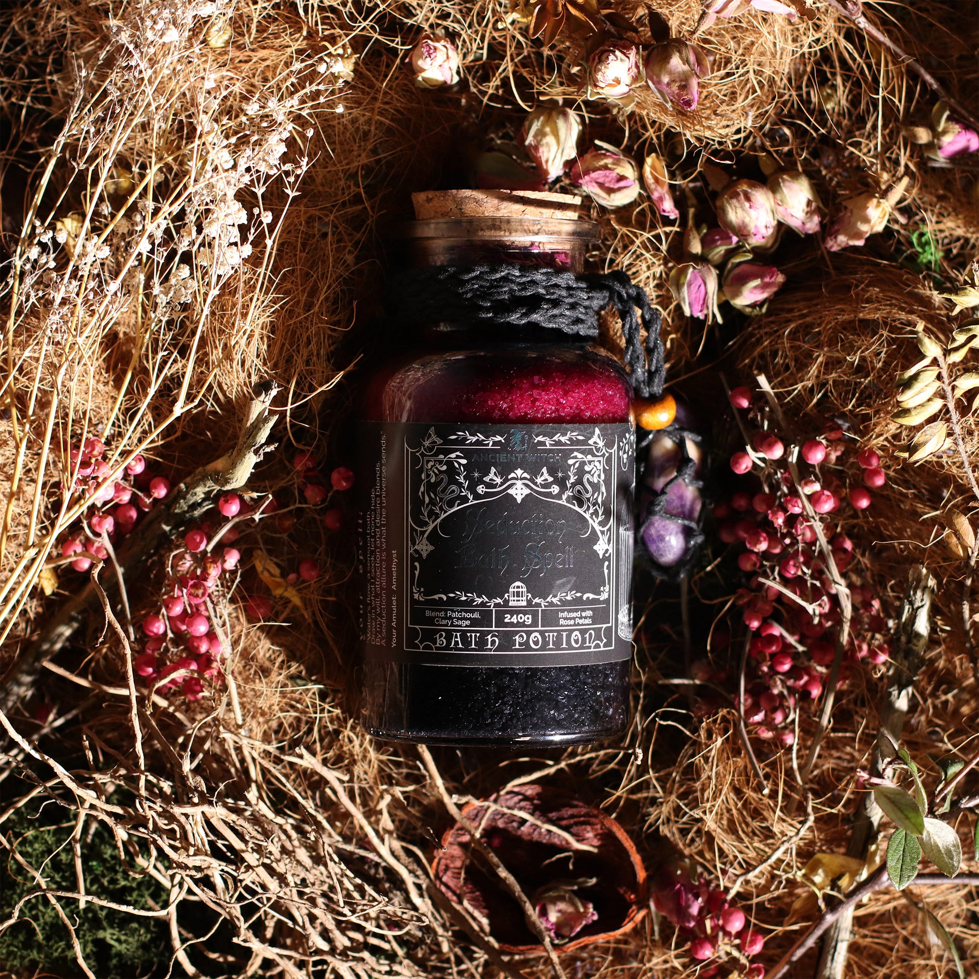 Bottle labeled 'Dark Potions' surrounded by dried plants and berries