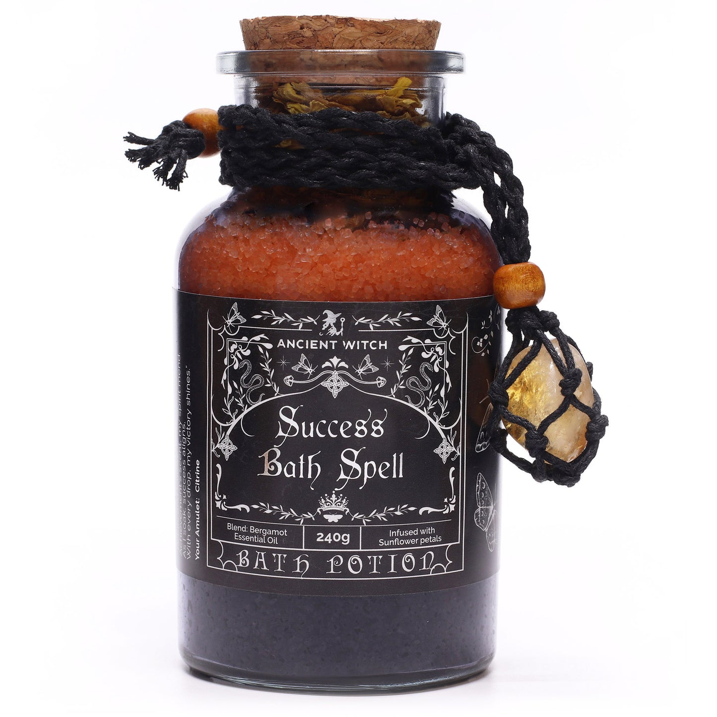 Bottle labeled 'Success Bath Spell' with decorative elements on a white background