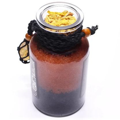 Glass jar with layered contents on a white background