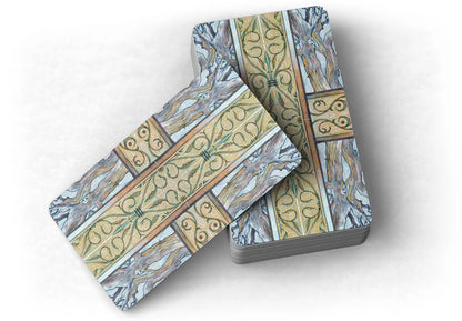 Decorative tarot card backs with intricate patterns on a white background